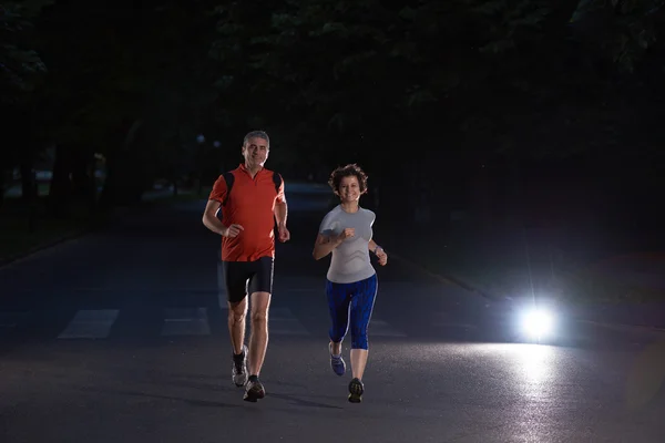 Couple jogging at early morning — Stock Photo, Image