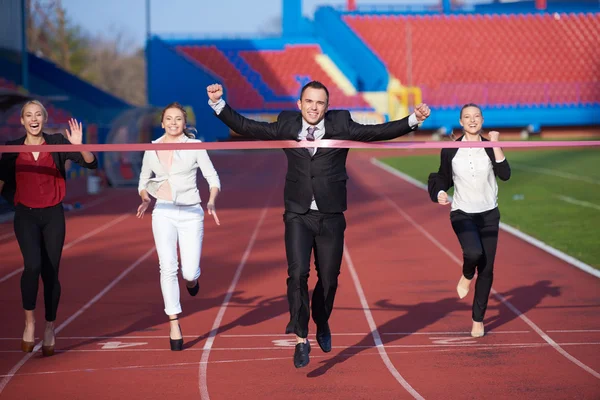 Empresários correndo em pista de corrida — Fotografia de Stock