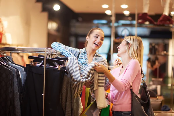 happy young girls in shopping mall