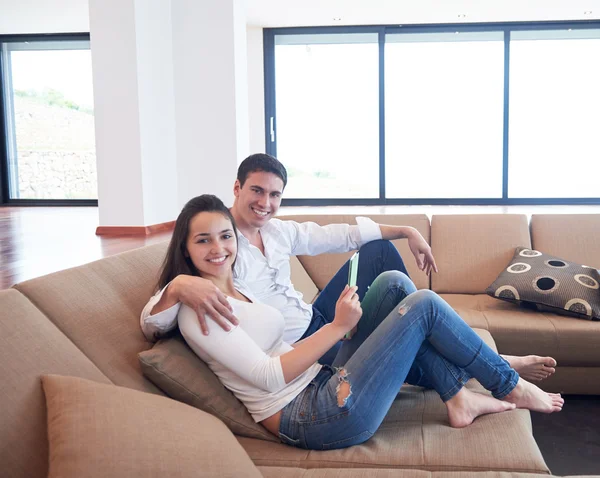 Couple at modern home using tablet computer — Stock Photo, Image