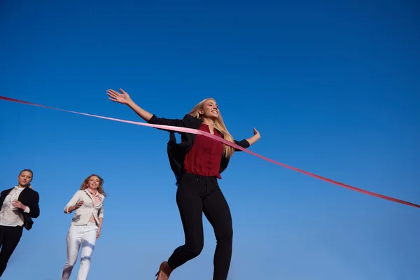 Business women running on racing track — Stock Photo, Image