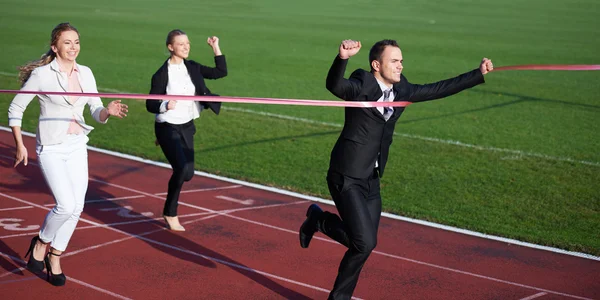 Business people running on racing track — Stock Photo, Image