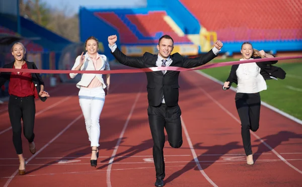 Business people running on racing track — Stock Photo, Image