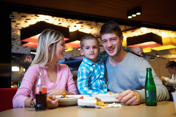 family having lunch in shopping mall