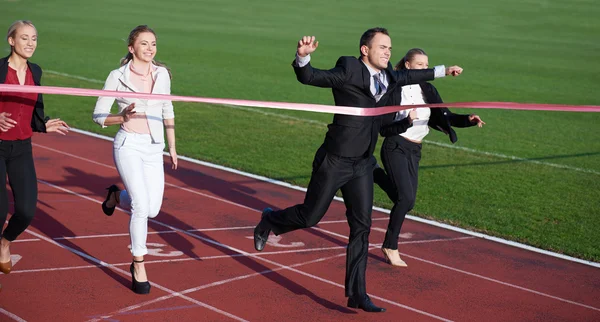 Business people running on racing track — Stock Photo, Image