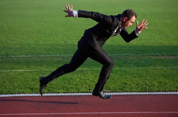 Businessman ready to sprint — Stock Photo, Image