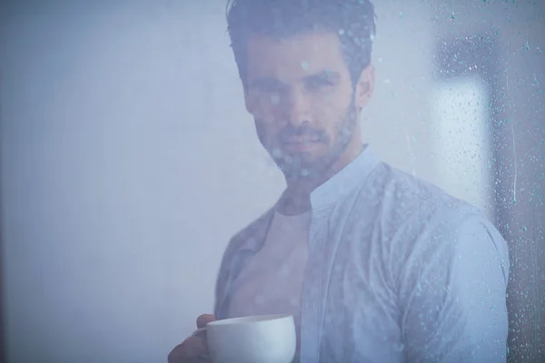 Man drinking first morning coffee — Stock Photo, Image