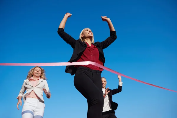 Business women running on racing track — Stock Photo, Image