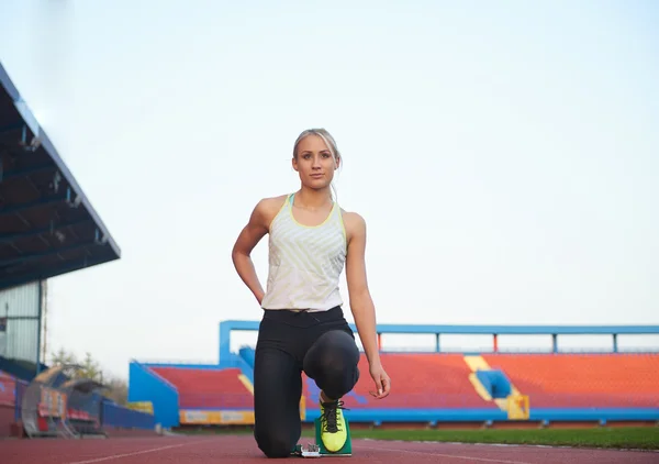 Pixelated design of woman  sprinter leaving starting blocks — Stock Photo, Image