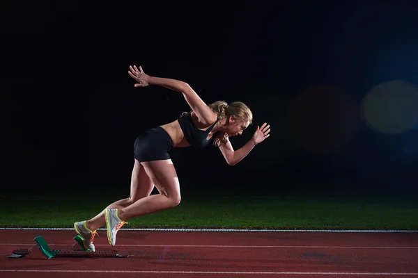 Pixelated design of woman  sprinter leaving starting blocks — Stock Photo, Image