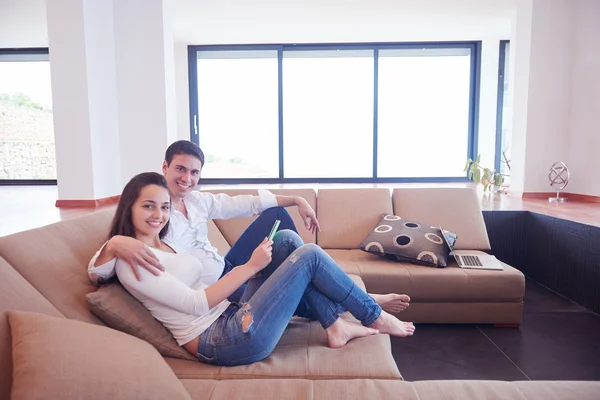 Romantic Relaxed Young Couple Modern Home Using Tablet Computer Royalty Free Stock Photos