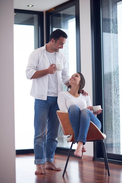 Relaxet young couple drink first morning coffee Royalty Free Stock Images