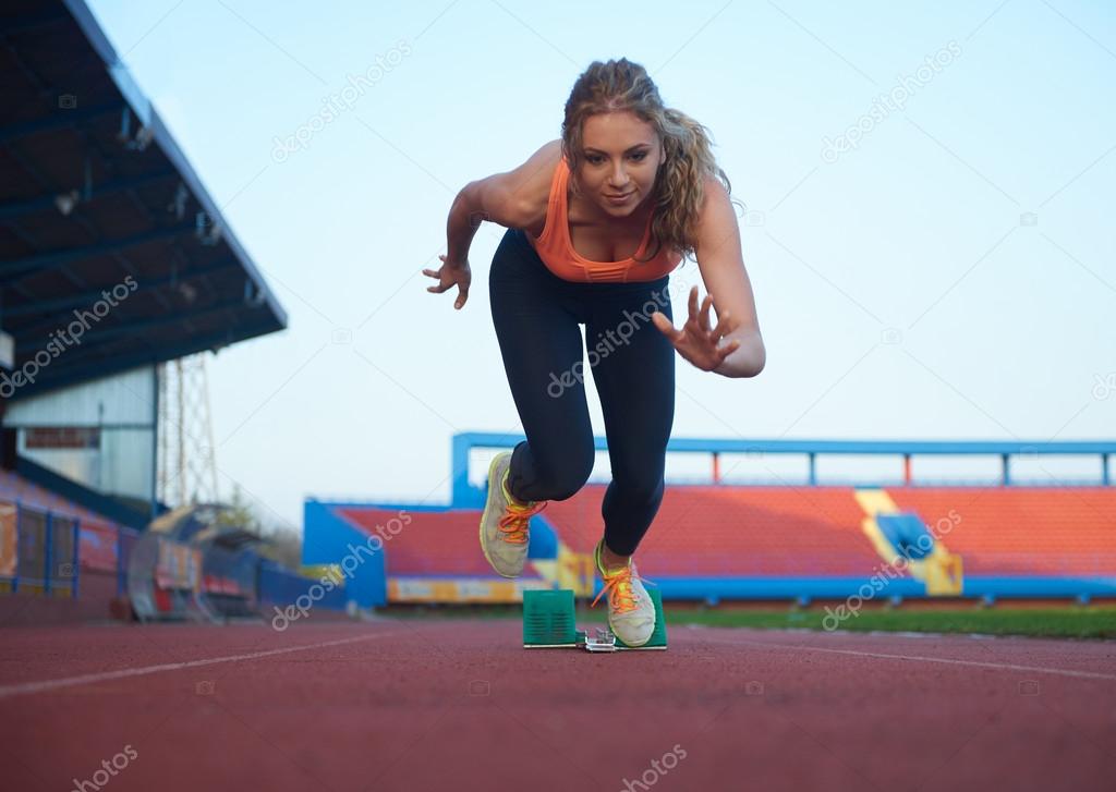 pixelated design of woman  sprinter leaving starting blocks