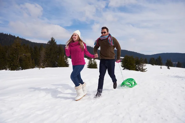 Couple having fun in snow — Stock Photo, Image