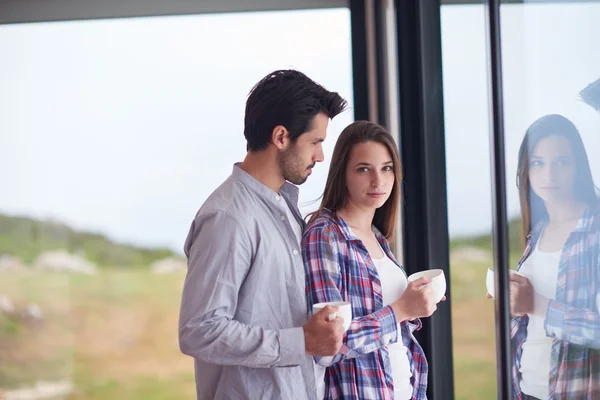 Relaxet young couple drink first morning coffee — Stock Photo, Image