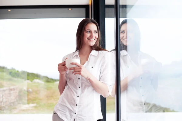 Beautiful young woman drinking first morning coffee — Stock Photo, Image