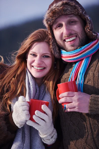 Couple drinking warm tea at winter — Stock Photo, Image