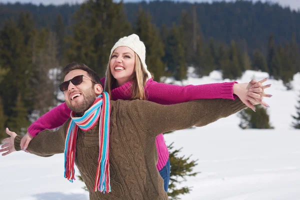 Couple having fun in snow — Stock Photo, Image