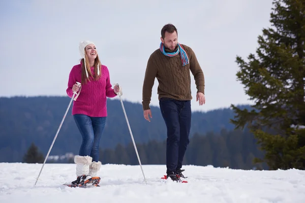 Couple having fun on fresh show on winter vacation — Stock Photo, Image