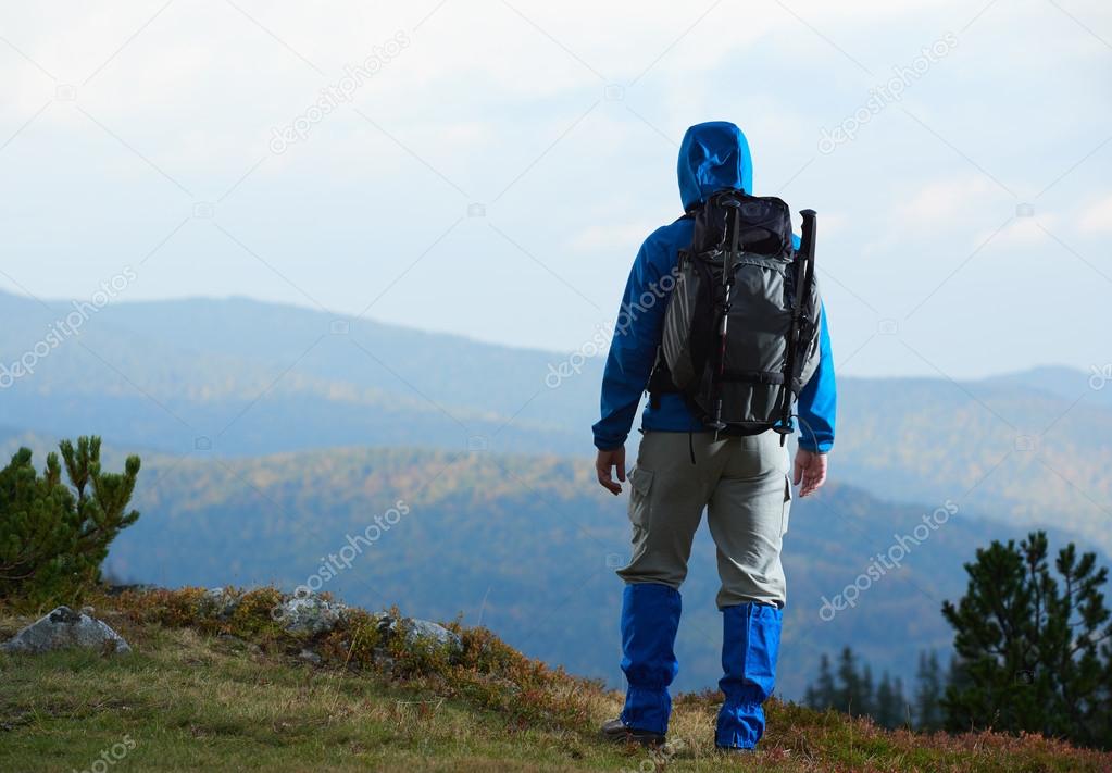 advanture man with backpack hiking