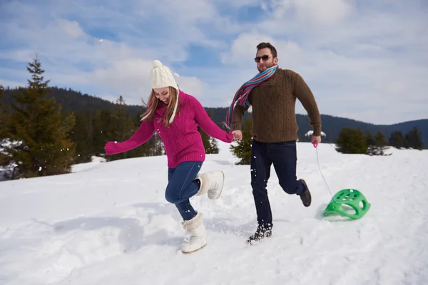 Couple having fun on fresh show — Stock Photo, Image