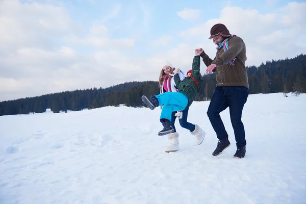 Happy family in snow — Stock Photo, Image