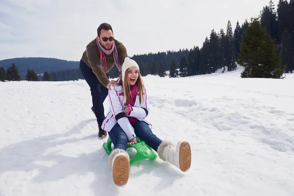 Couple having fun on fresh show — Stock Photo, Image