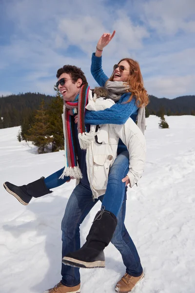 Couple having fun on fresh show on winter vacation — Stock Photo, Image