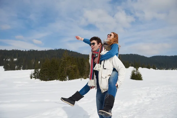 Couple having fun on fresh show on winter vacation — Stock Photo, Image