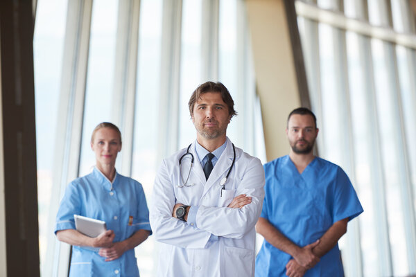 group of medical staff at hospital, handsome doctor in front