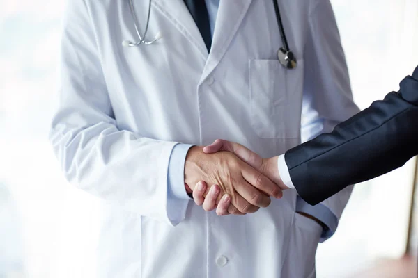 Doctor handshake with a patient — Stock Photo, Image