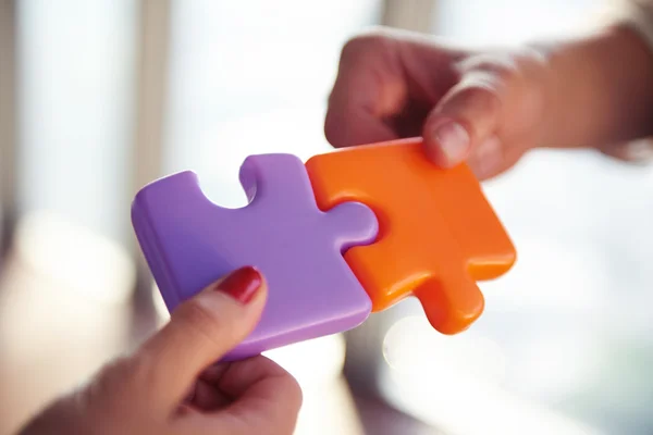 Business people group assembling jigsaw puzzle — Stock Photo, Image