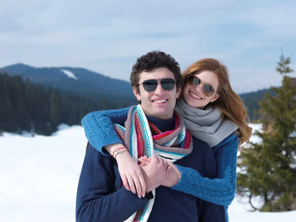 Couple having fun in fresh show — Stock Photo, Image