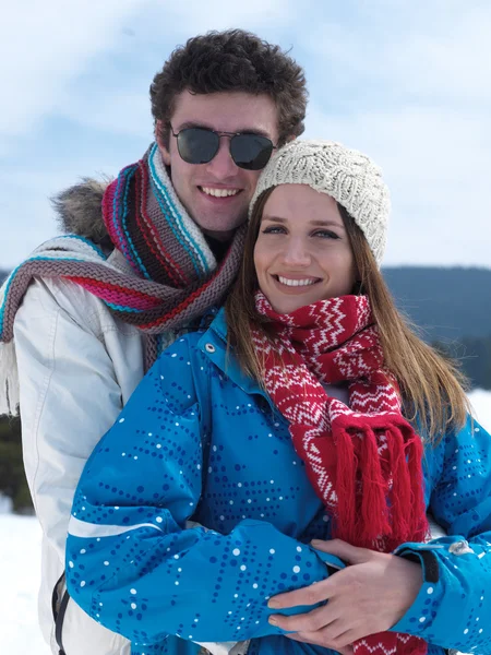 Couple having fun on fresh snow on winter vacation — Stock Photo, Image