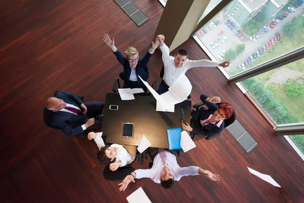 Top view of business people group throwing dociments in air — Stock Photo, Image