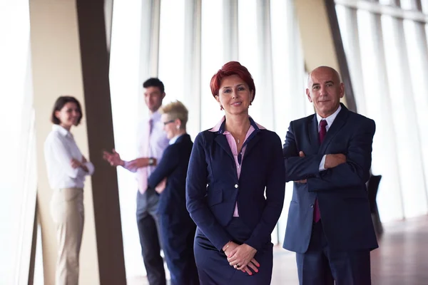 Diversa gente de negocios grupo con pelirroja mujer en frente — Foto de Stock