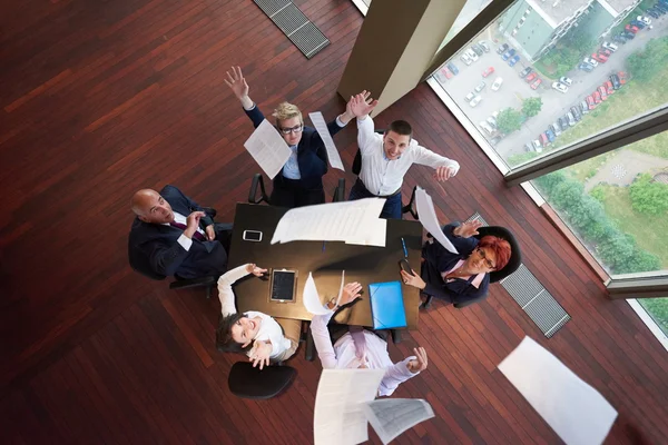 Top view of business people group throwing dociments in air — Stock Photo, Image