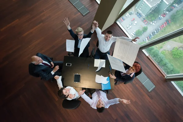 Top view of business people group throwing dociments in air — Stock Photo, Image