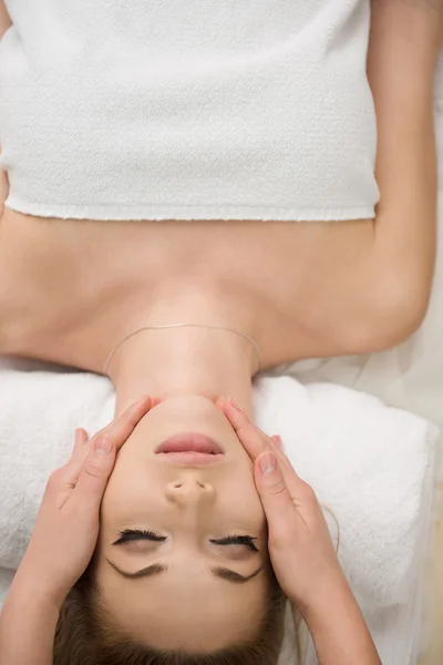 Woman getting face and head  massage in spa salon — Stock Photo, Image