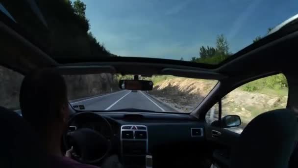 Man driving a car on country road trip in nature — Stock Video