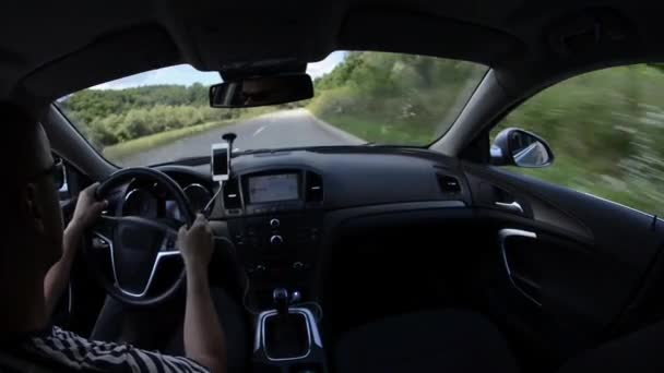 Man driving a car with gps navigation system — Stock Video