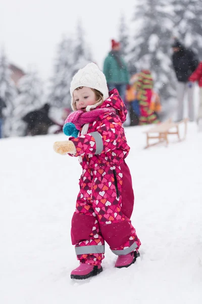 Little girl at snowy winter day — Stock Photo, Image