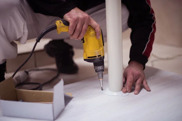 Repairman working with drilling machine — Stock Photo, Image