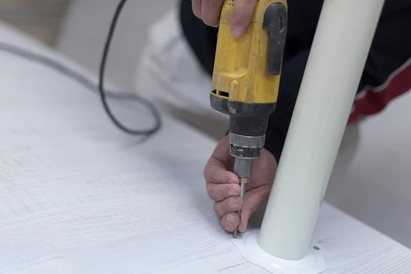 Repairman working with drilling machine — Stock Photo, Image