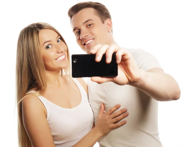 Smiling couple with smartphone — Stock Photo, Image