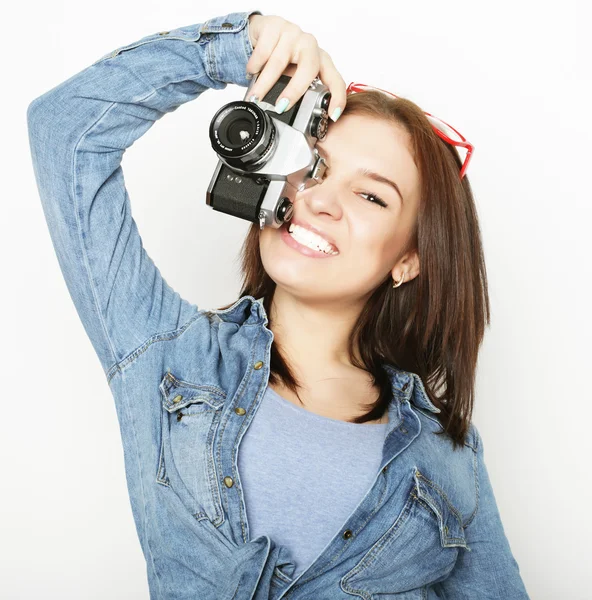 Young pretty woman holding camera — Stock Photo, Image