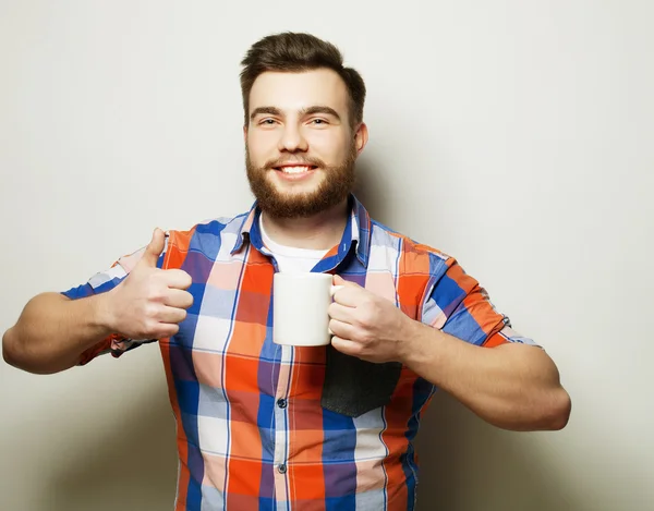 Mand med en kop kaffe - Stock-foto