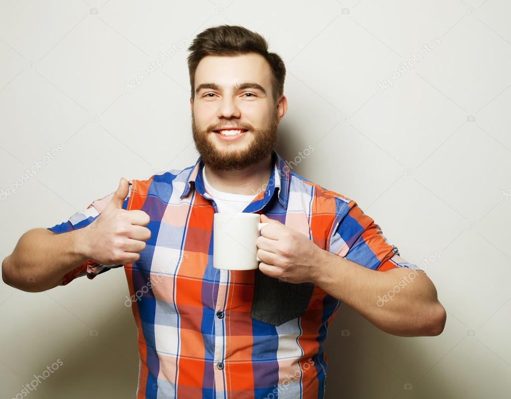 man with a cup of coffee