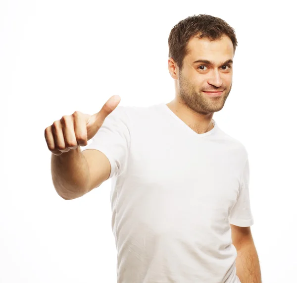 Szczęśliwy przystojny mężczyzna pokazując kciuki w górę — Zdjęcie stockowe