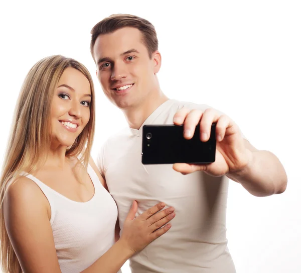 Coppia sorridente con smartphone — Foto Stock